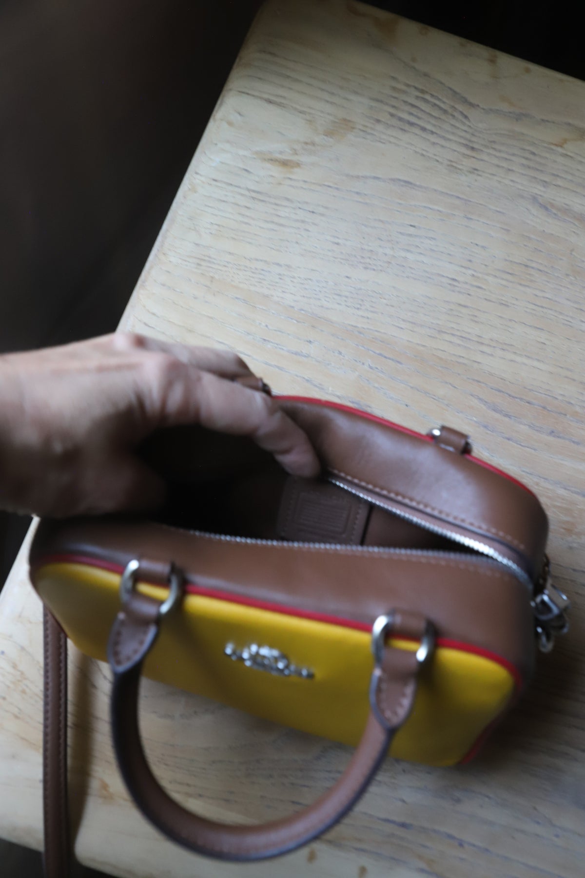 Small yellow Coach bag with cross strap