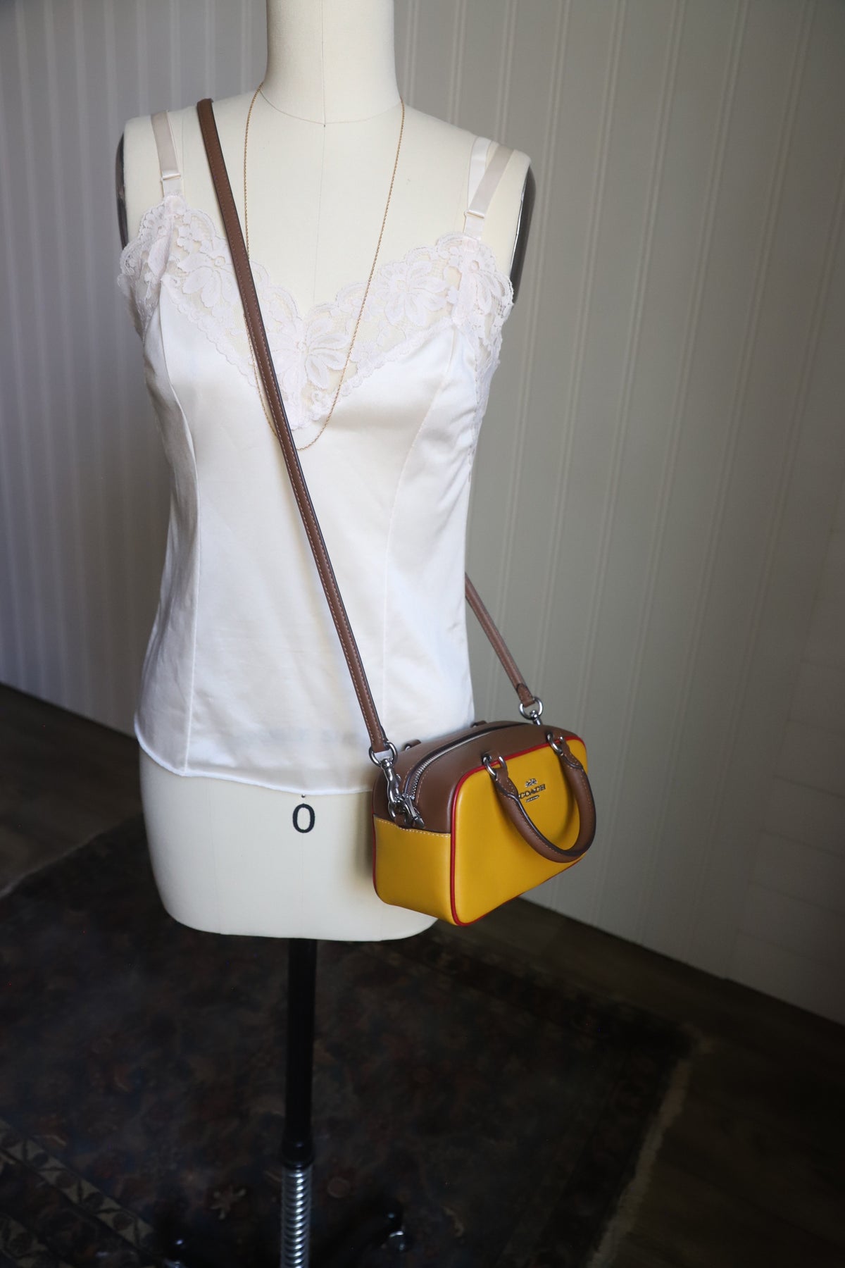 Small yellow Coach bag with cross strap