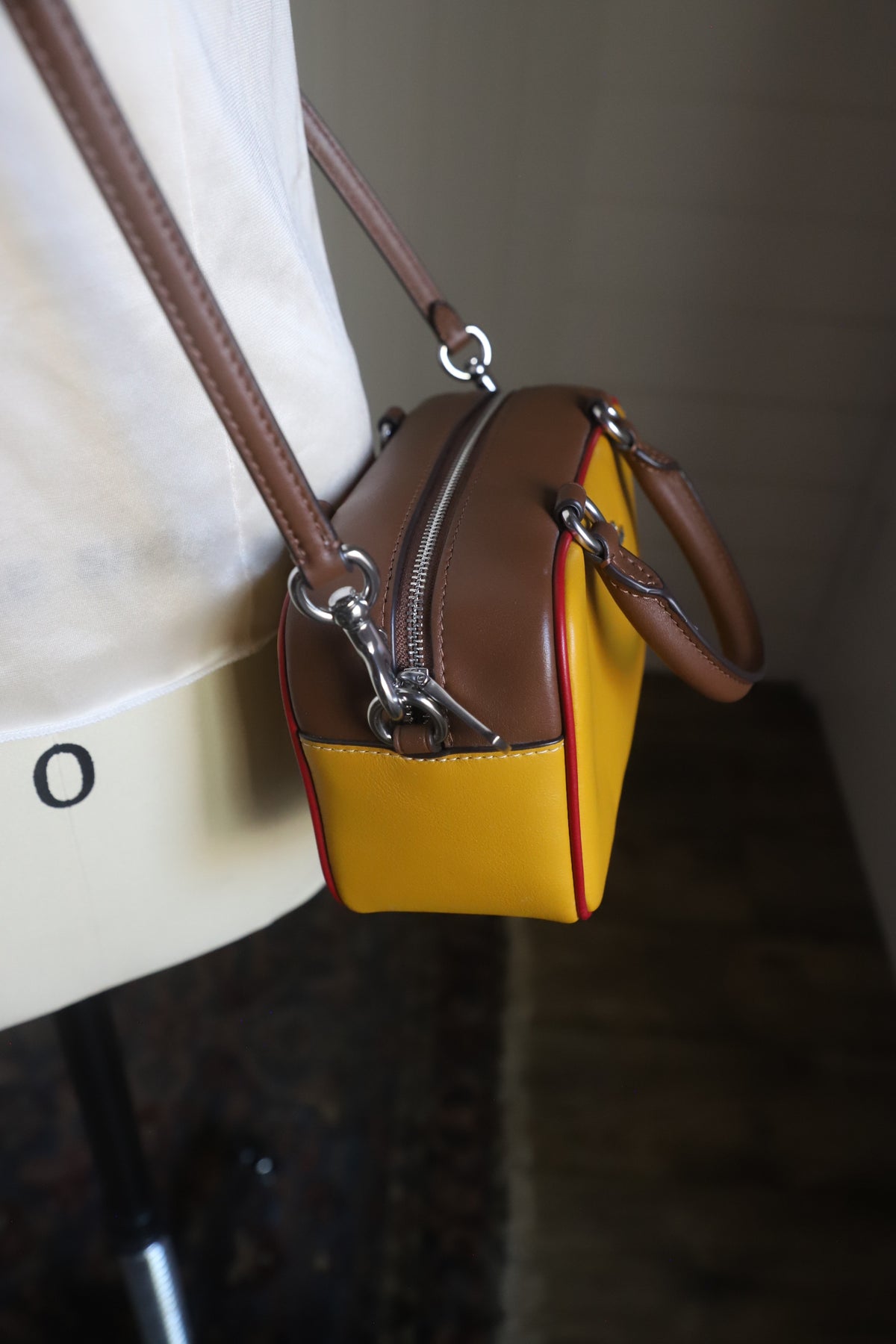 Small yellow Coach bag with cross strap