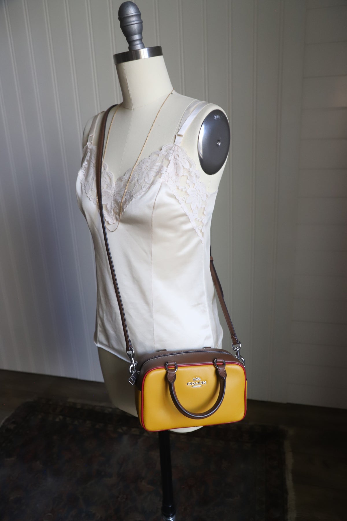 Small yellow Coach bag with cross strap