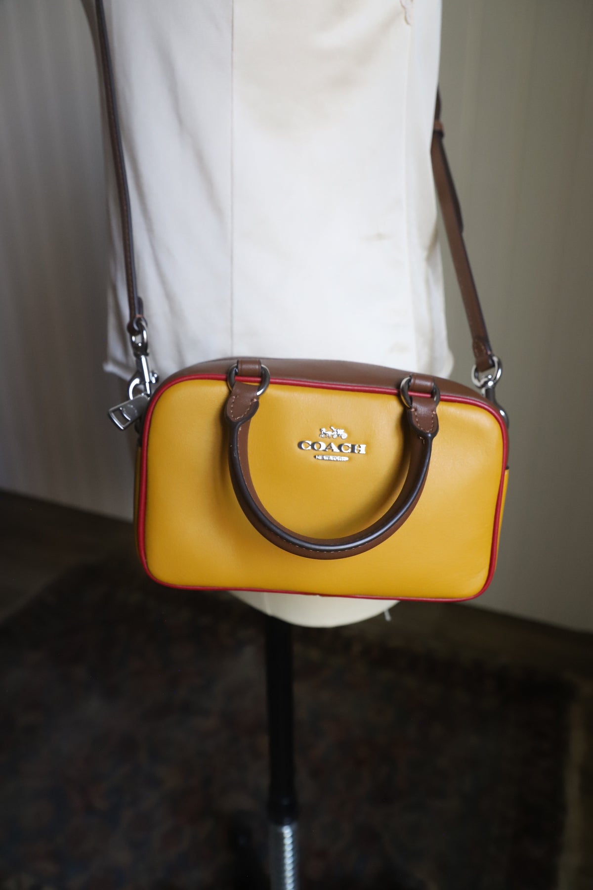Small yellow Coach bag with cross strap
